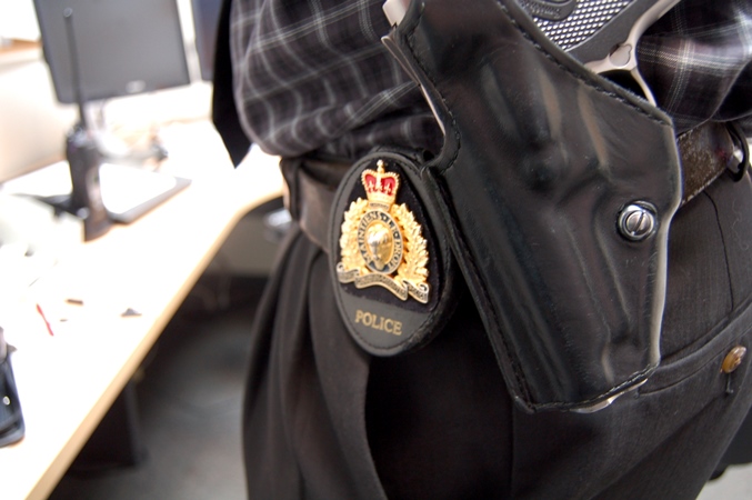 RCMP badge on a plain clothe officer