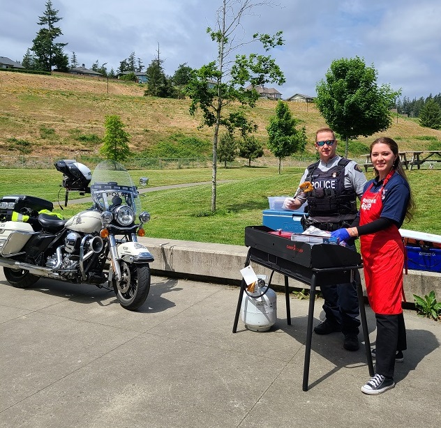 Cst Cole Brewer with West Shore RCMP Municipal Employee Shania Luna who is a member of the Lyackson First Nation