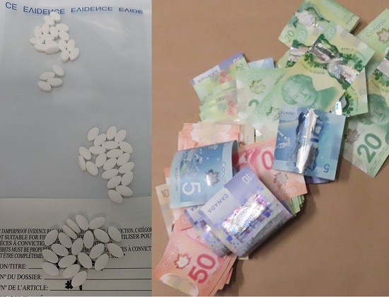 Photo of Ocycontin pills and cash found by police, 